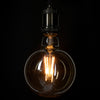 GloboStar® 99043 Λάμπα E27 G125 Γλόμπος LED LONG FILAMENT 8W 840 lm 320° AC 85-265V Edison Retro με Μελί Γυαλί Ultra Θερμό Λευκό 2200 K Dimmable