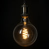 GloboStar® 99137 Λάμπα E27 G125 Γλόμπος LED SOFT SPIRAL FILAMENT 6W 510 lm 320° AC 85-265V Edison Retro με Διάφανο Γυαλί Θερμό Λευκό 2700 K Dimmable